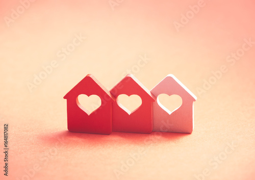 Three small houses with heart