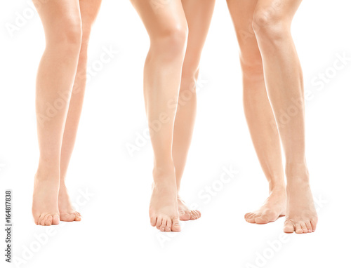Beautiful female legs isolated on white © Africa Studio