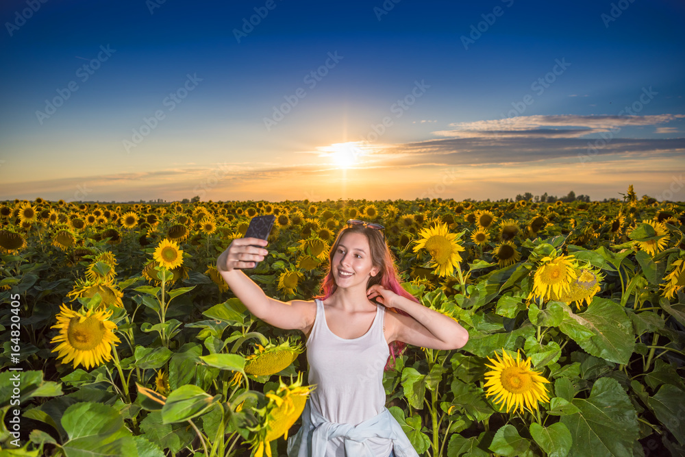 Fototapeta premium Beautiful girl taking selfie
