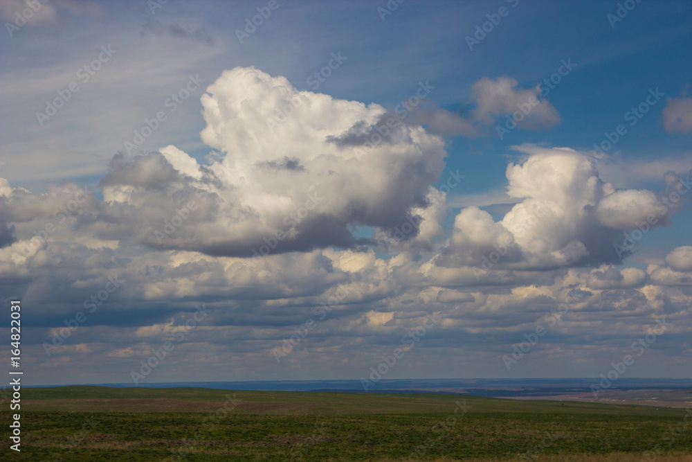Steppe in spring, Kazakhstan. Amazing clouds and sky Steppe in spring, Kazakhstan. Amazing clouds and sky