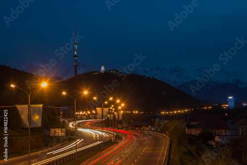 Almaty city night view, Kok Tobe hill. Lights trails at night on the road photo