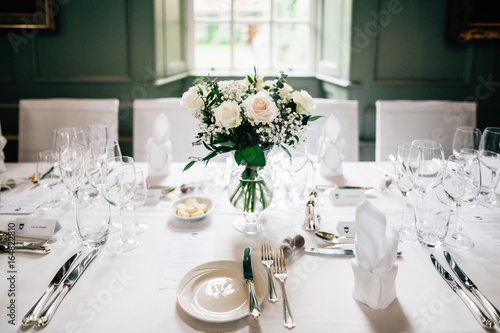 Vase of roses on dining table
