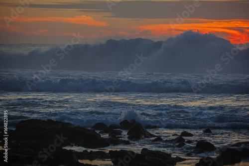 Big waves on bright dramatic sunset background on Lanzarote island seashore, Canary Islands, Spain