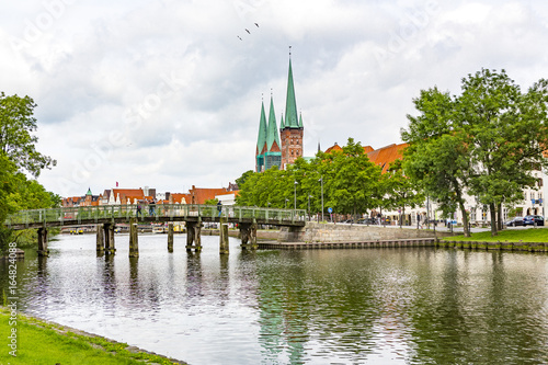 the trave one front of the old city of luebeck © NordStock