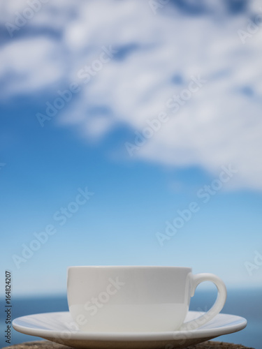 Coffee espresso on wood table nature background on the beach, Beauty nature background