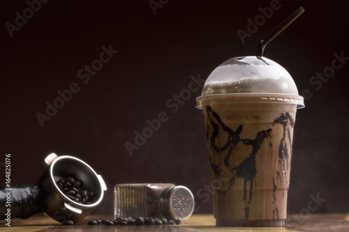 ice Mocha coffee on wood floor