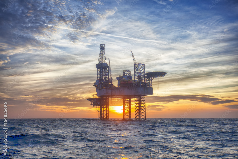 HDR of Offshore Jack Up Rig in The Middle of The Sea at Sunset Time 