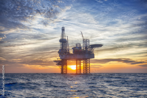 HDR of Offshore Jack Up Rig in The Middle of The Sea at Sunset Time  © Lukasz Z
