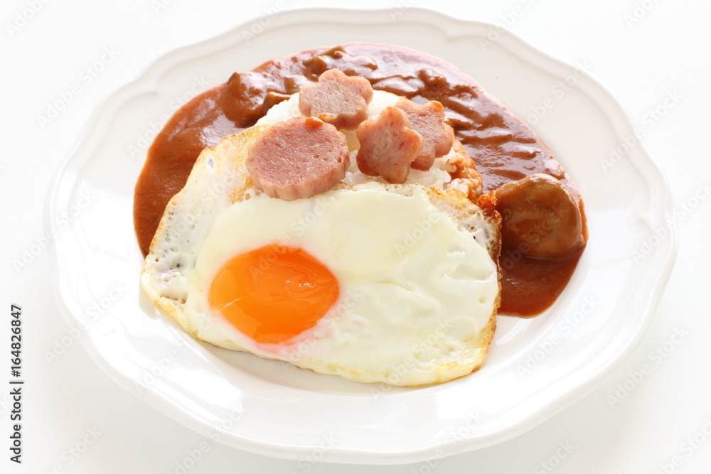 Hawaiian food, luncheon meat and sunny side up fried egg on rice Hawaiian food, luncheon meat and sunny side up fried egg on rice