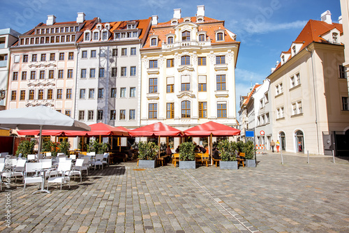 View on the beautiful buildings with cafe terrace on the main square in Dresden city, Germany