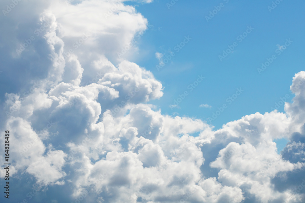 A blue sky with beautiful large fluffy clouds on a sunny and clear day. A blue sky with beautiful large fluffy clouds on a sunny and clear day.