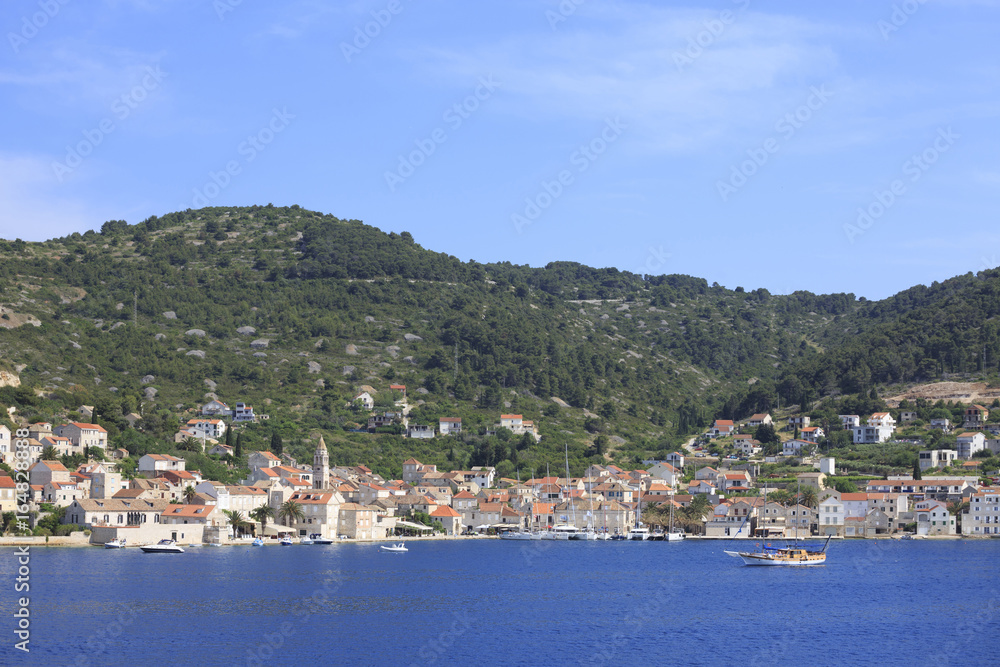 Small town with stone houses by the sea, Photo of town by the sea in summer