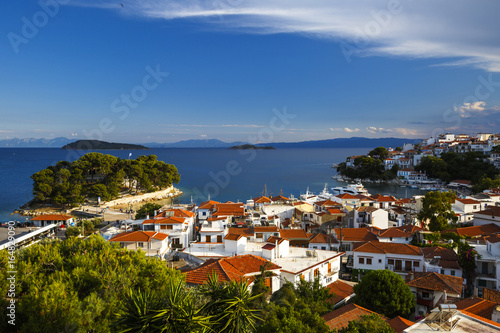 View of the old harbour on Skiathos island and Euboea in the distance, Greece. 
