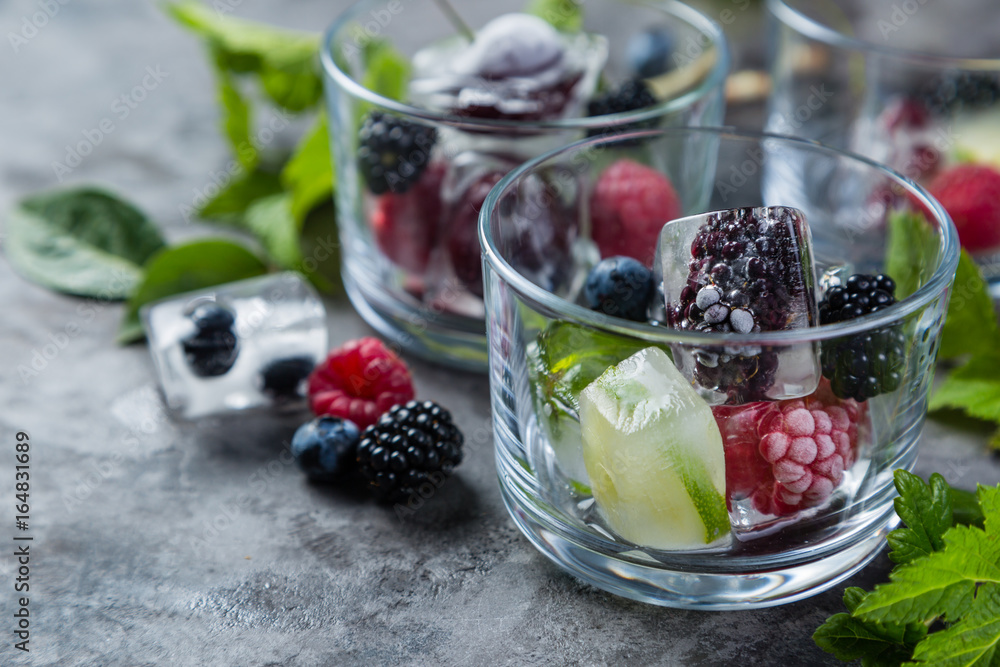 Frozen berries in ice cubes Frozen berries in ice cubes
