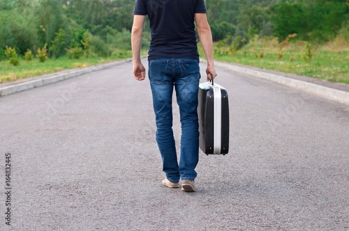 Man is going along the road.