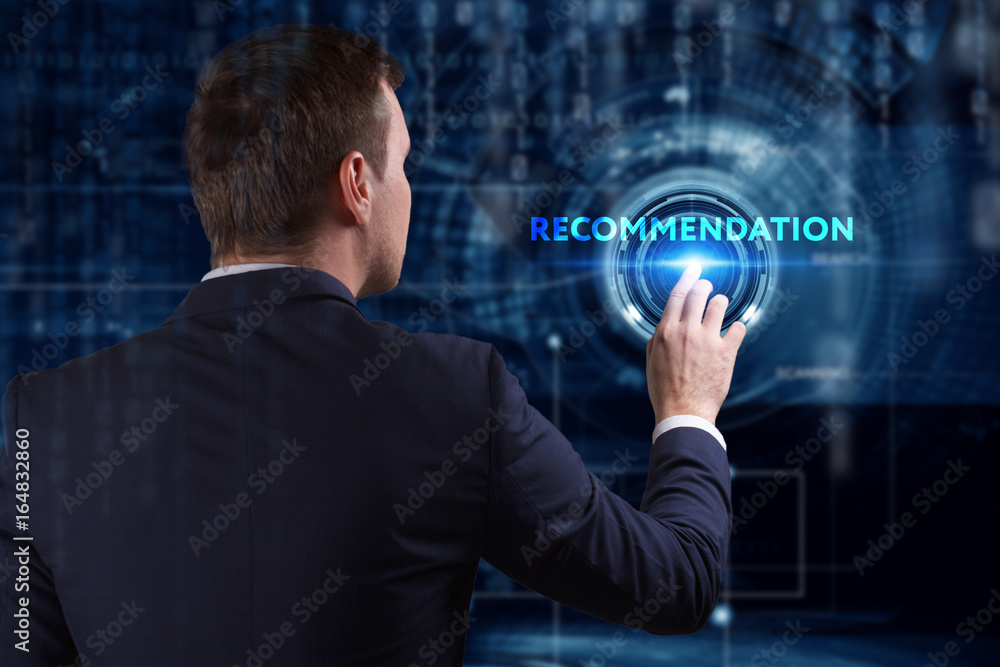 Business, Technology, Internet and network concept. Young businessman working on a virtual screen of the future and sees the inscription: Recommendation Business, Technology, Internet and network concept. Young businessman working on a virtual screen of the future and sees the inscription: Recommendation