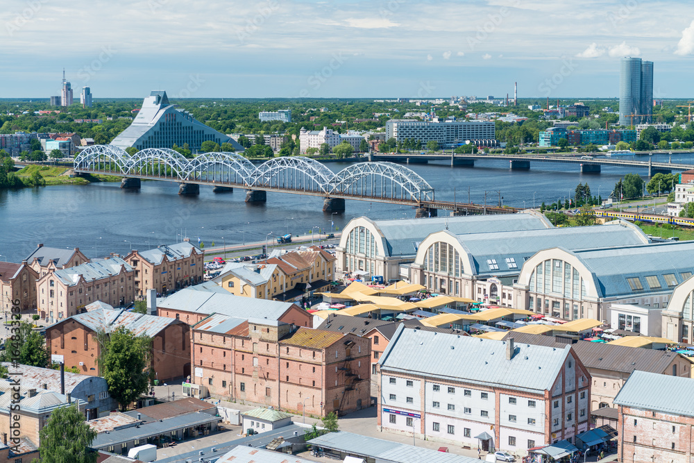 RIGA, LATVIA - JULY 7, 2017: Panoramic aerial city view of market. Riga attracts 2 million tourists annually