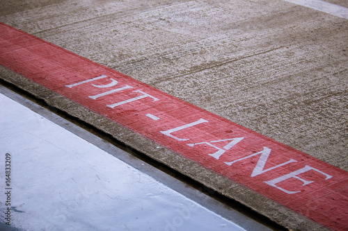 Papier peint Word Pit Lane panted on the ground at the Silverstone racetrack in the UK