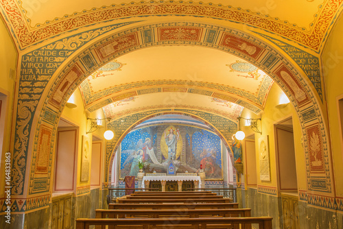 Obraz na plátne TURIN, ITALY - MARCH 15, 2017: The little chapel Capella Pinardi - the first chapel of Don Bosco the founder of Salesians with the frescoes by Paolo Giovanni Crida (1886  - 1967)