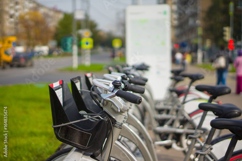 Photography Close up of rental bicycles on rental station on the street