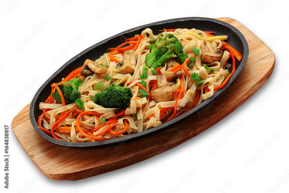 Udon noodels with vegetables and mashrooms on a stone plate isolated on white background Udon noodels with vegetables and mashrooms on a stone plate isolated on white background