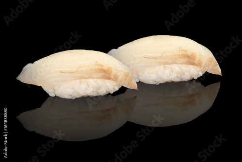 Japanese cuisine. Sushi nigiri over black background.