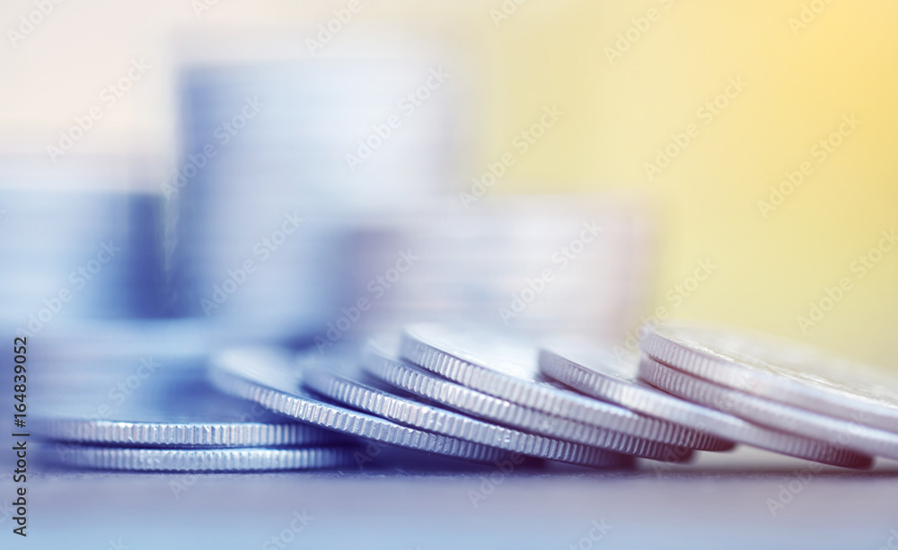 Row of coins on wood background for finance and Saving concept,Investment, Economy, Soft focus and dark style. Row of coins on wood background for finance and Saving concept,Investment, Economy, Soft focus and dark style.