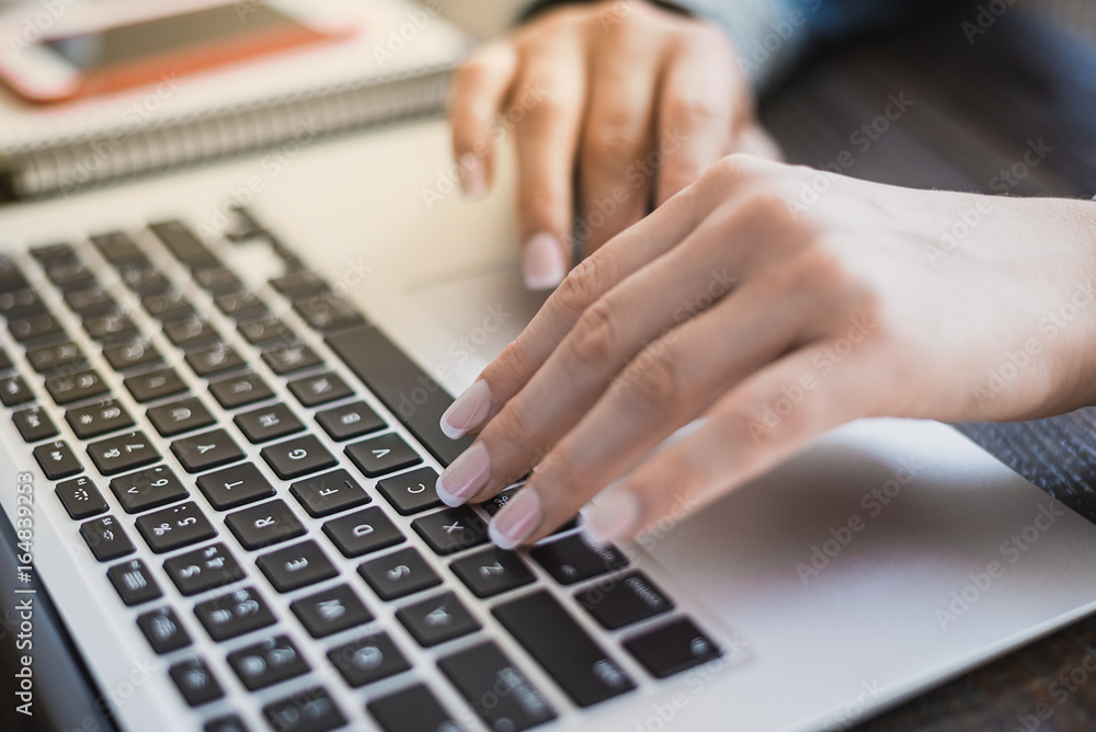 Morning business woman. Female hands working on a laptop, close-up. Horizontal frame Morning business woman. Female hands working on a laptop, close-up. Horizontal frame