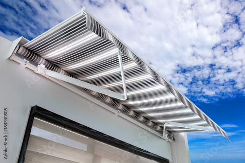 Canvas awning with a sky background photo