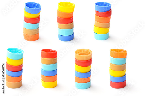 pile of colorful plastic bottle cap on white background