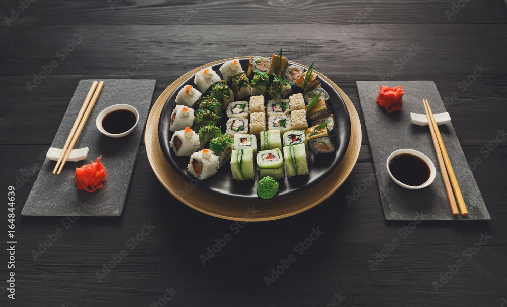 Eating set of sushi maki and rolls in japanese resaturant Eating set of sushi maki and rolls in japanese resaturant