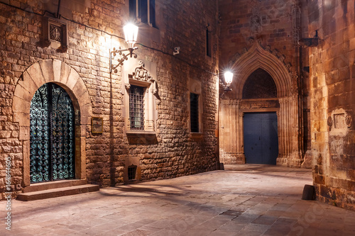 Photography Cobbled empty medieval street in Barri Gothic Quarter at night, Barcelona, Catal