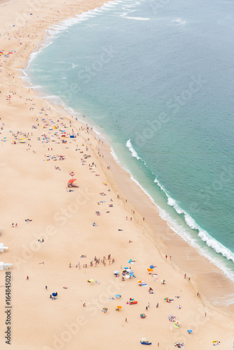 Fototapeta Naklejka Na Ścianę i Meble -  Beach in Portugal in summer, people in holidays

