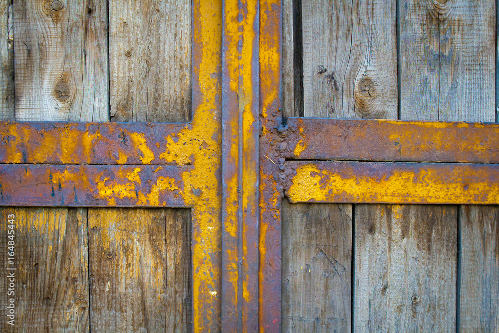 Old wooden background. Metal frame