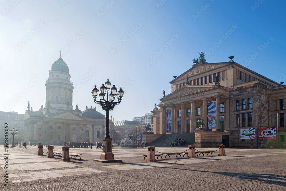 BERLIN, GERMANY, FEBRUARY - 14, 2017: The Konzerthaus building and the memorial of Friedrich Schiller and German dom on the Gendarmenmarkt square.