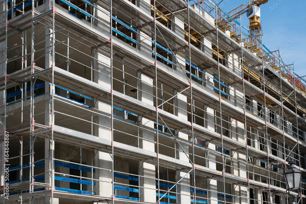 construction site - scaffolding on building facade construction site - scaffolding on building facade