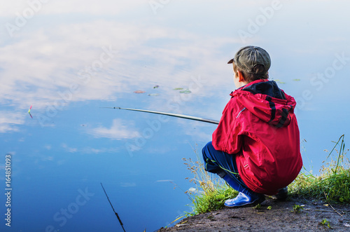little boy catches a fish