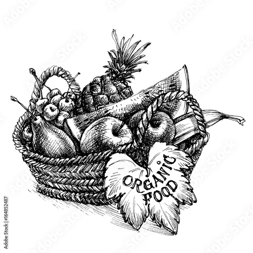Basket full of fruits, organic food written on a leaf
