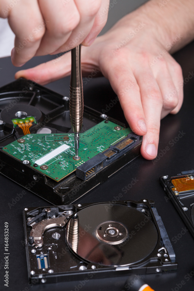 Naklejka premium Hard disc drive disassembling close up