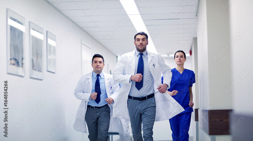 group of medics walking along hospital group of medics walking along hospital