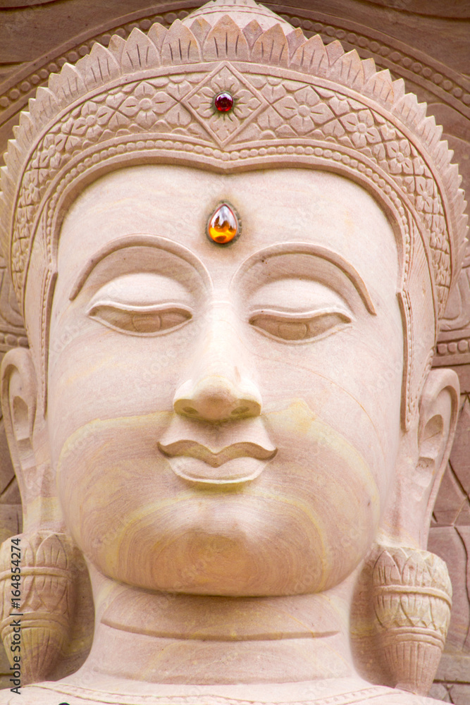 White stone carving buddha with naga at Wat Tai Phra Chao Yai Ong Tue,Ubonratchathani Province,Thailand.