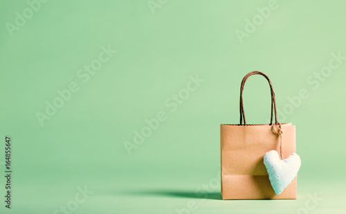 Gift bag with heart on a green background