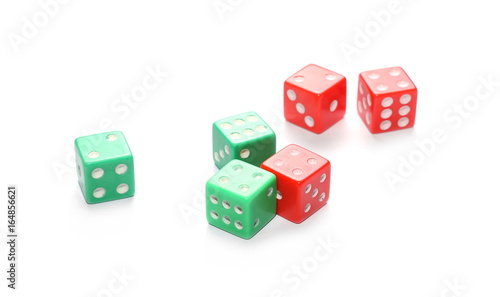 Red and green gambling dice isolated on white background