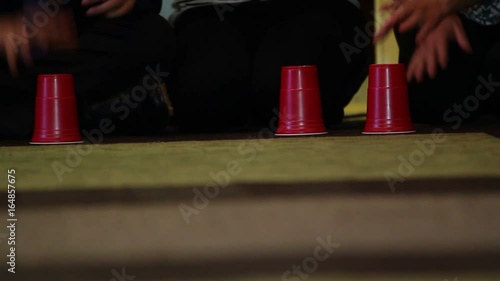 People playing with cups