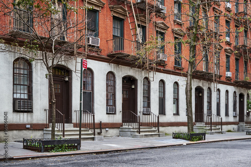 a row of brownstone townhomes