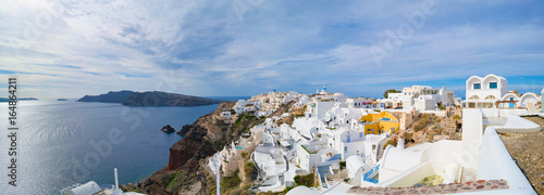 Panorama ofOia town on Santorini island, Greece. Traditional and famous white and rose houses over the Caldera, Aegean sea