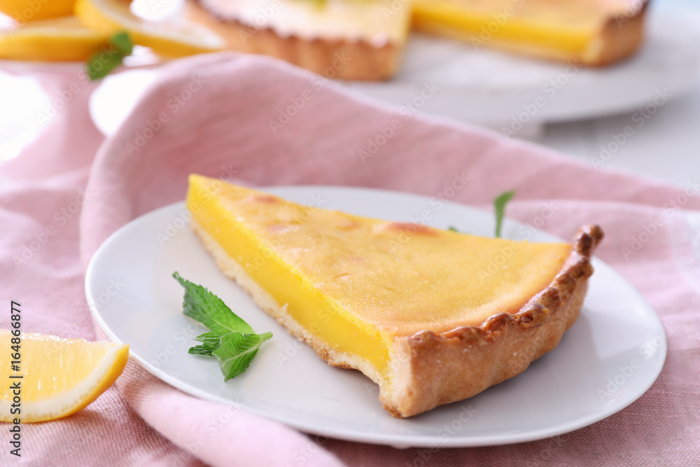 Plate with delicious lemon pie on table, closeup Plate with delicious lemon pie on table, closeup