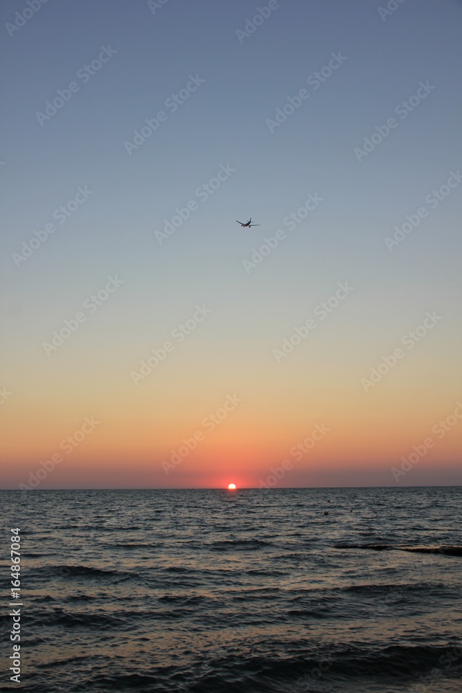 plane at sunset