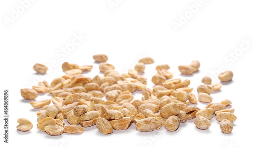 Pile salted fried peanut isolated on white