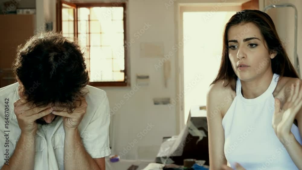 Couple in new home worried 4K slow motion Couple in new home worried 4K slow motion